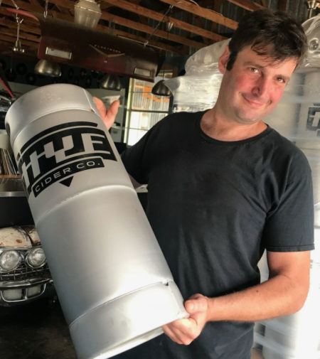 Cap'n with a keg of cider at Hye Cider Company